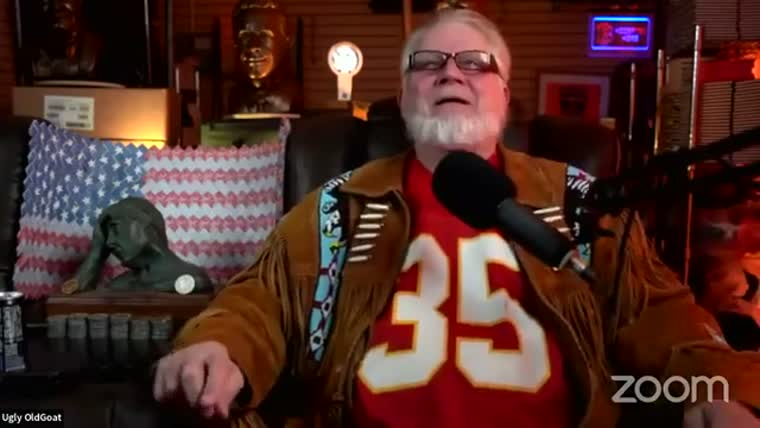 The same man, now with a white beard, in a fringed jacket
         and a red number 35 jersey.